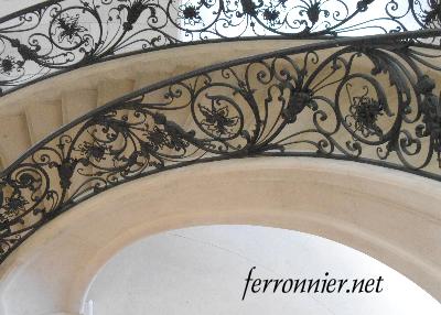 Rampe d'escalier débillardée en ferronnerie d'art